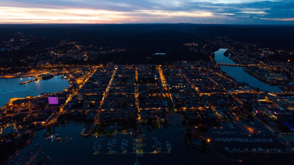 A birds eye view of a city lit up at night